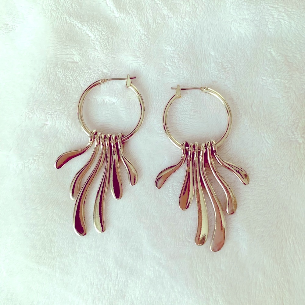 Silver hoop style earrings. **BOGO same or less$
